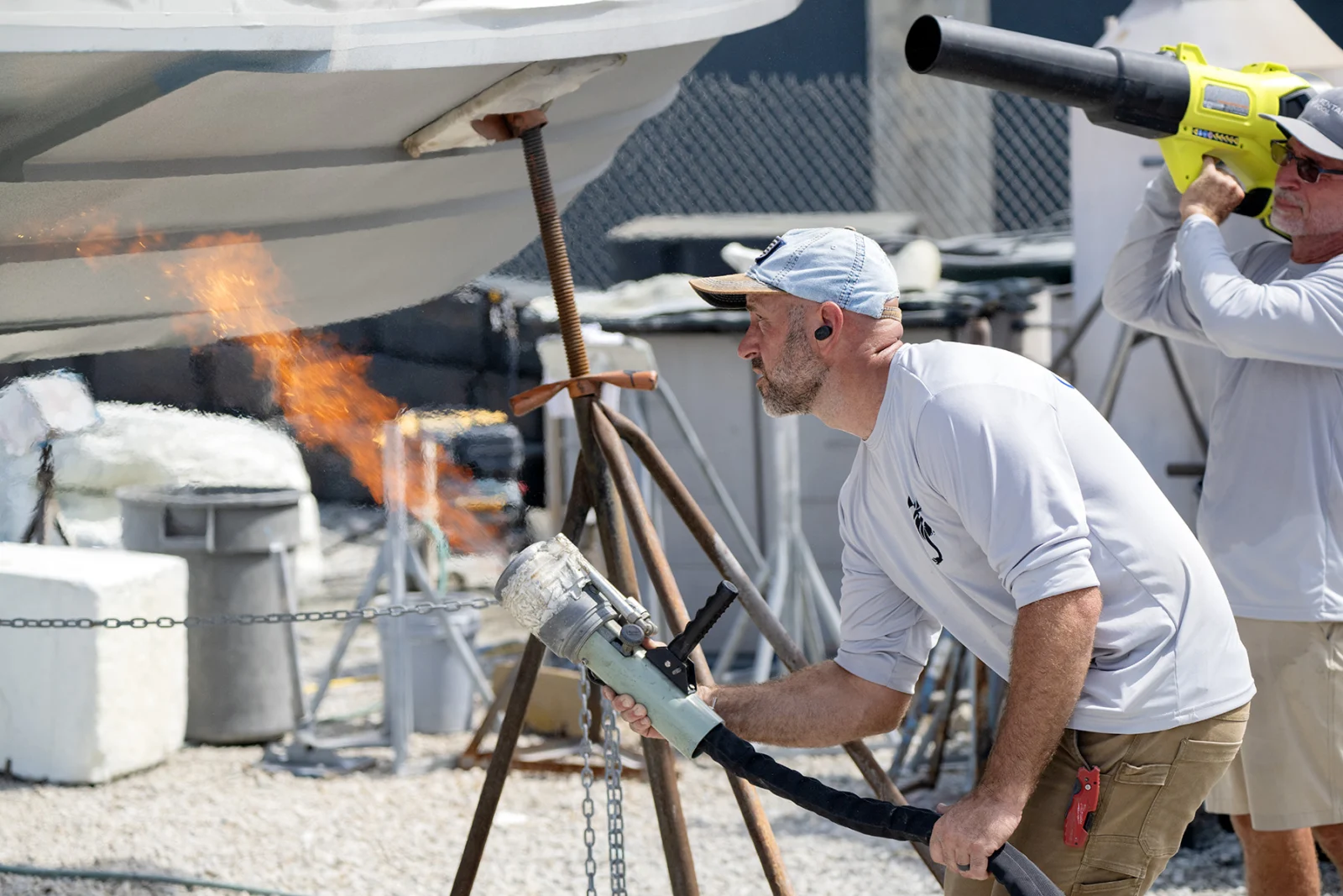 Aquaphobix flame-spray application to a boat hull in a hardstand yard
