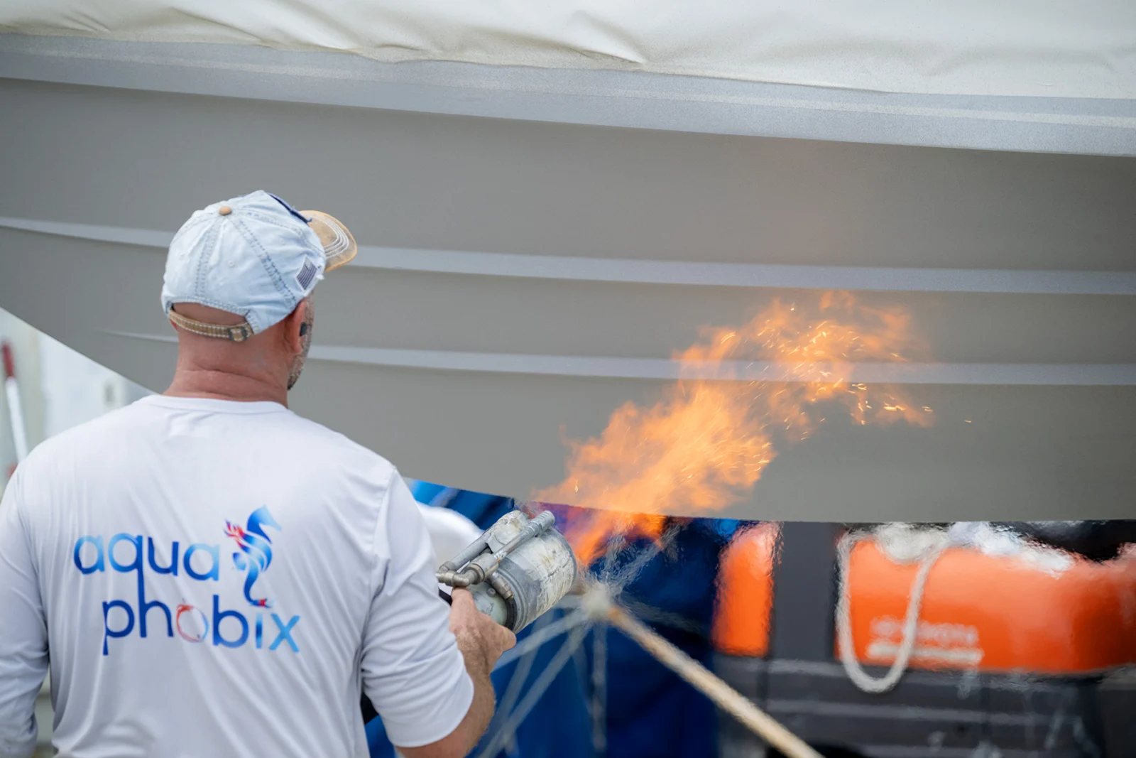 Aquaphobix technician coating a vessel hull