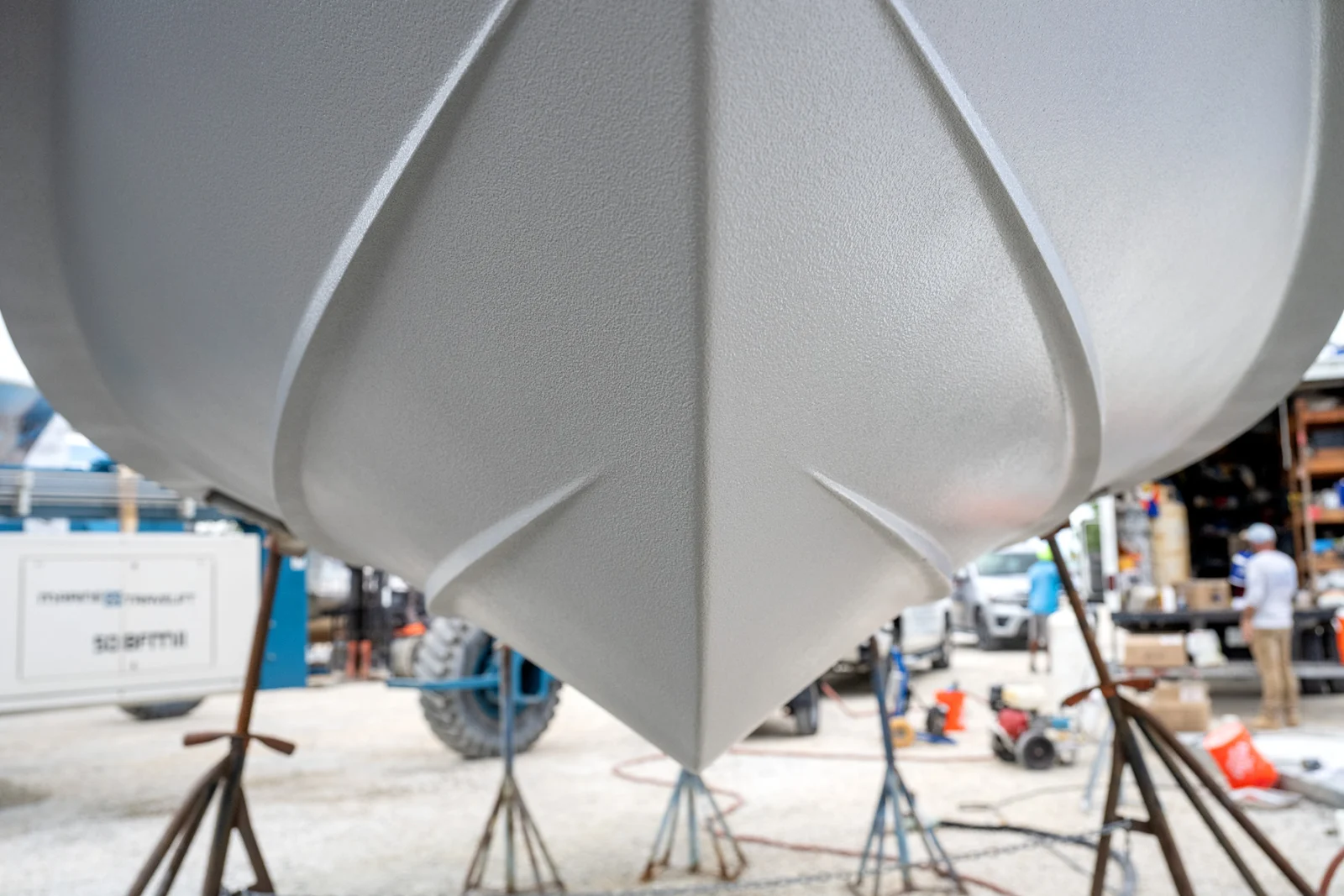 Finished Aquaphobix foul-release coating on a boat hull, showing the matt composite surface
